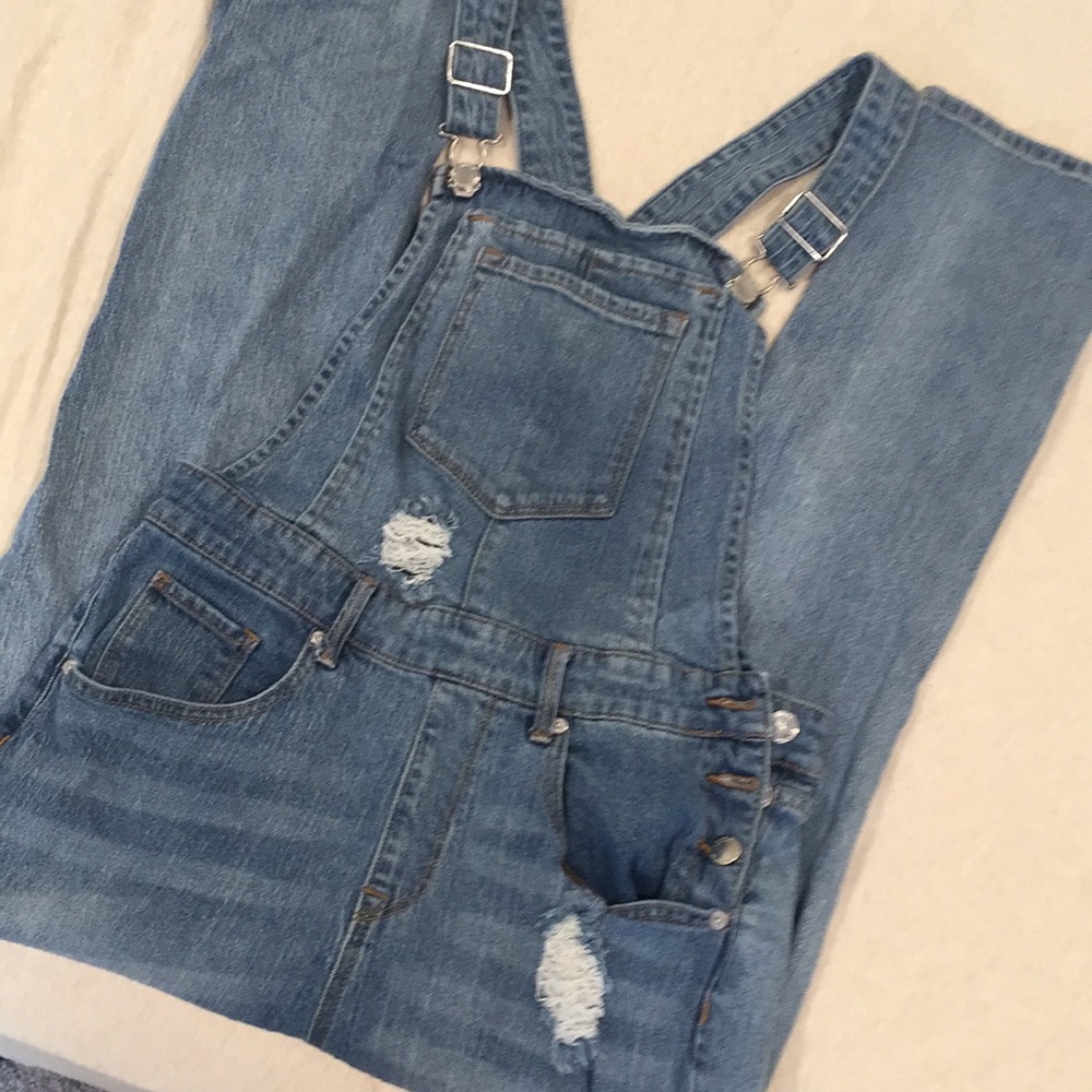 Distressed denim overalls